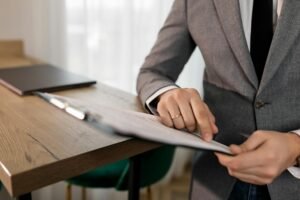electrician reviewing electrical certification documents on desk
